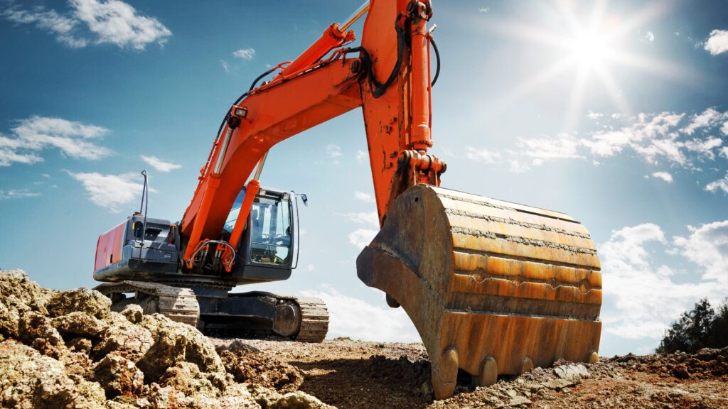 Bagger auf Baustelle Raupenbagger mit Aushub